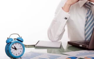 Boss looking at timesheets and disputing wages